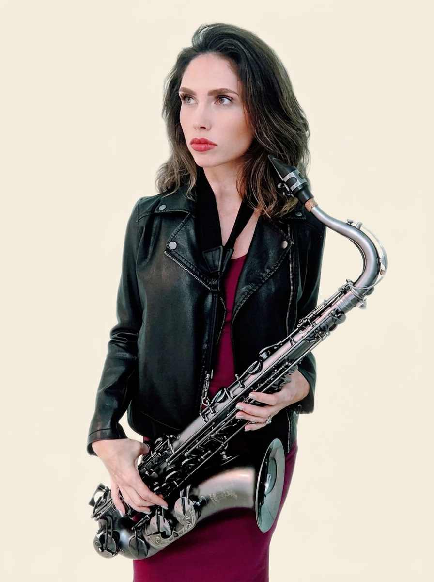 Amy Cyr holding her tenor saxophone in a leather jacket, editorial portrait